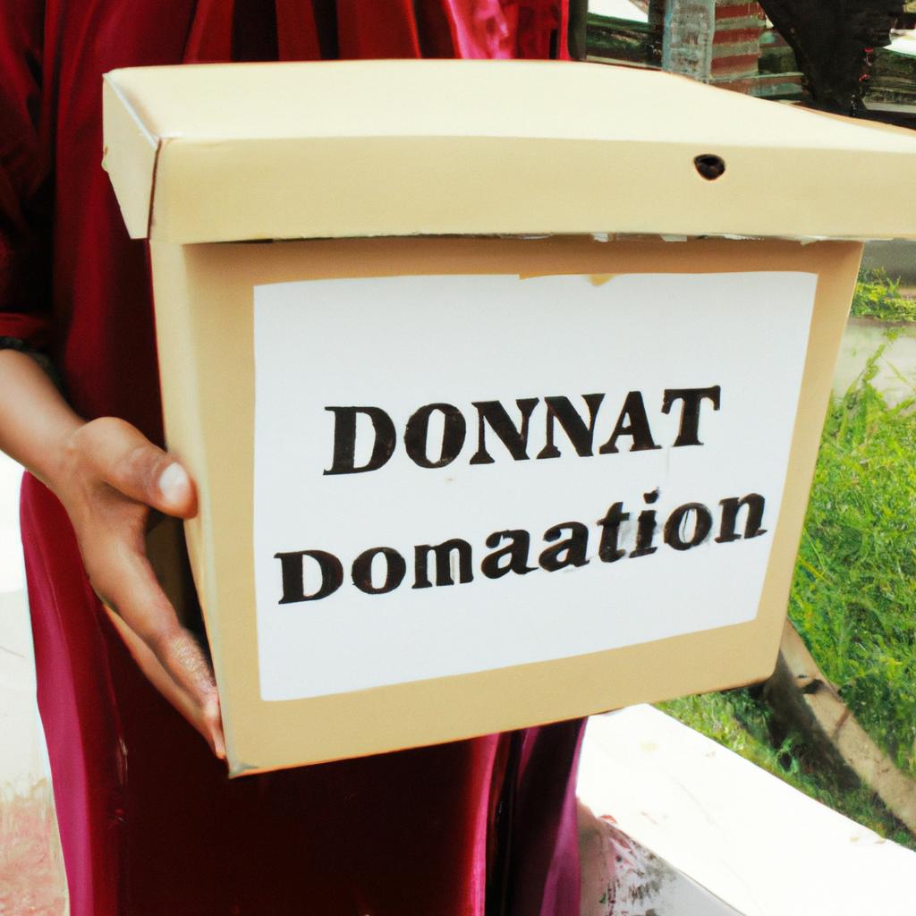 Person holding donation collection box